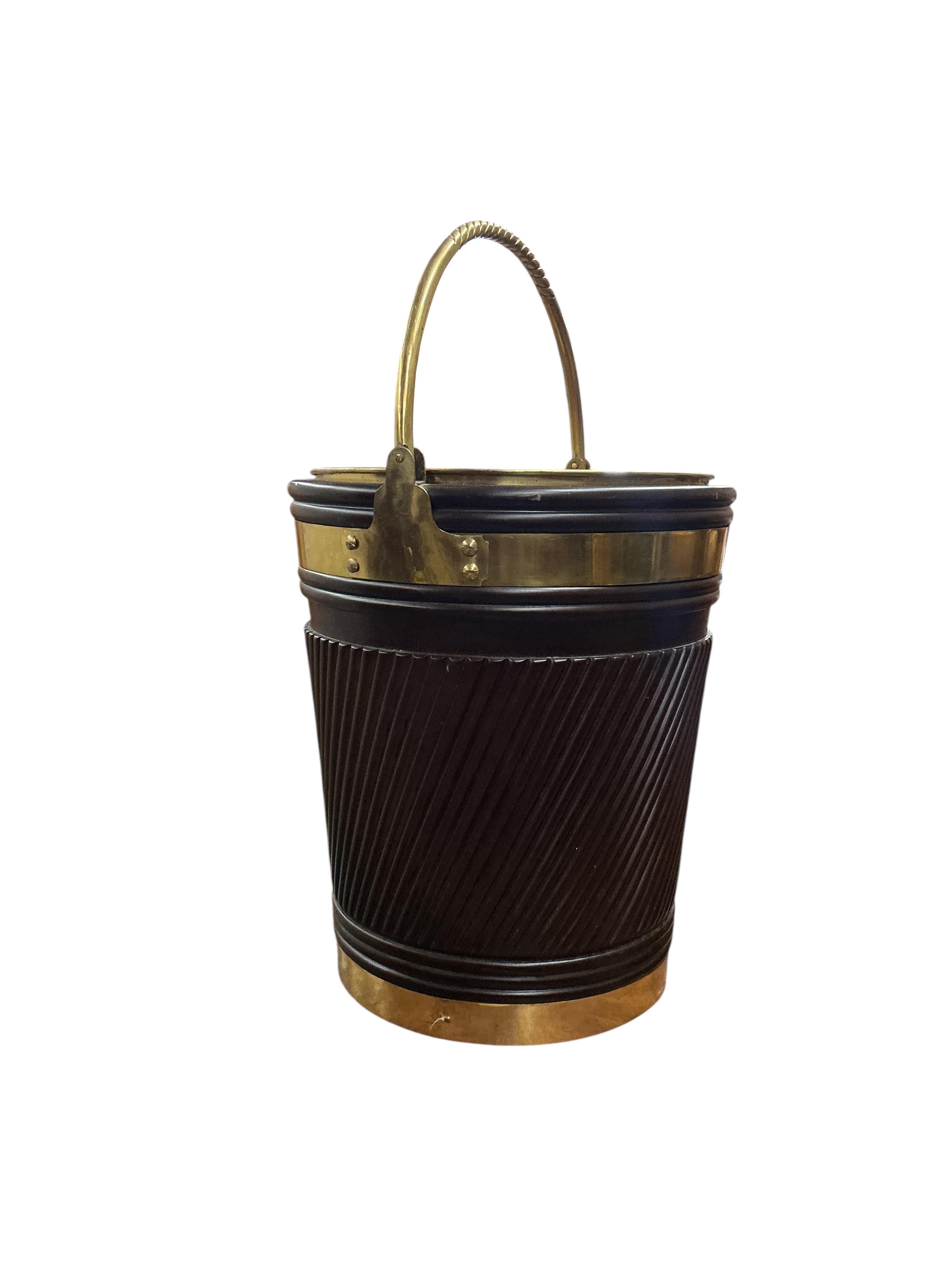A large reproduction George III Irish style brass bound mahogany peat bucket with brass liner, diameter 46cm, height 53cm